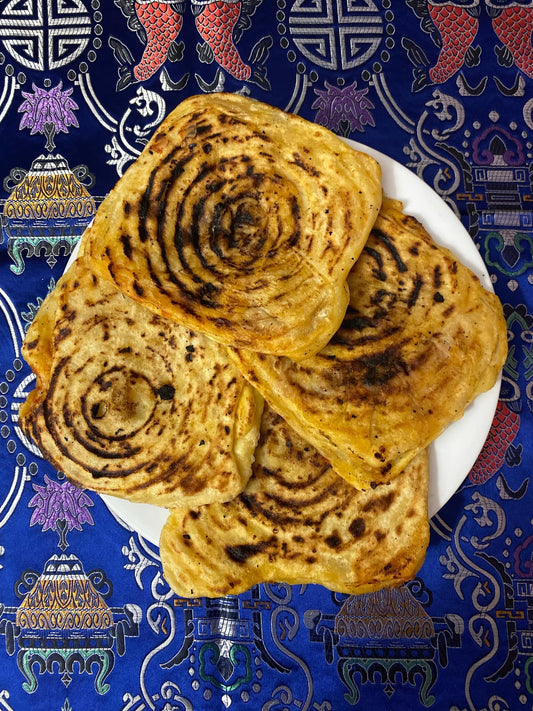 Galettes farcie "Mhadjeb" aux tomates et oignons